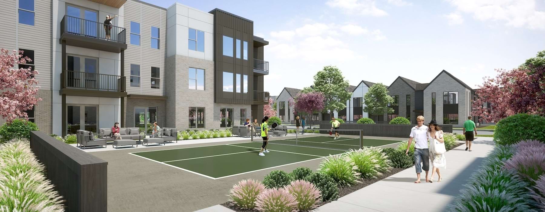 people playing pickleball in a courtyard