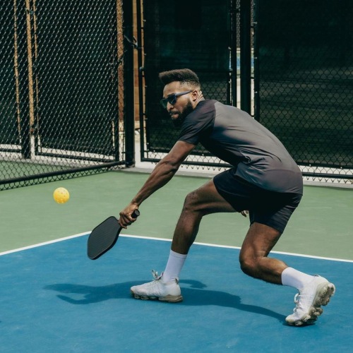 a person playing pickleball